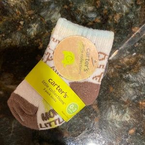 Brand new with tags! Three pairs of carters socks 0-3 months old